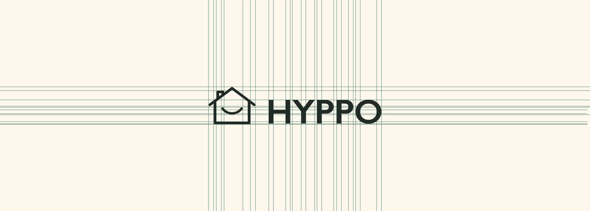 Construction du logo Hyppo sur une grille de design montrant les proportions et l’alignement du logotype dans une charte graphique.