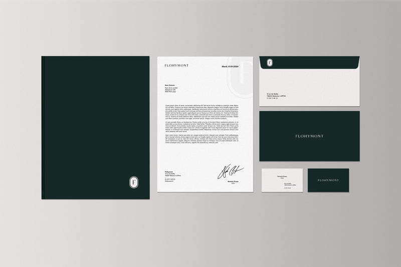 Papeterie de marque avec logo, cartes de visite et papier en-tête dans une identité visuelle élégante et minimaliste.